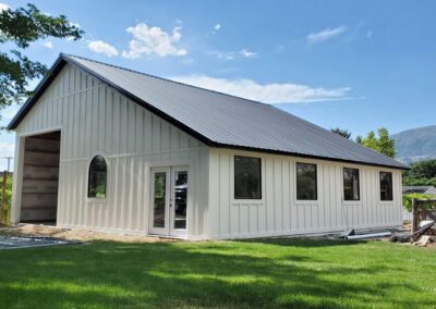 Big White Shed with Brown Roof